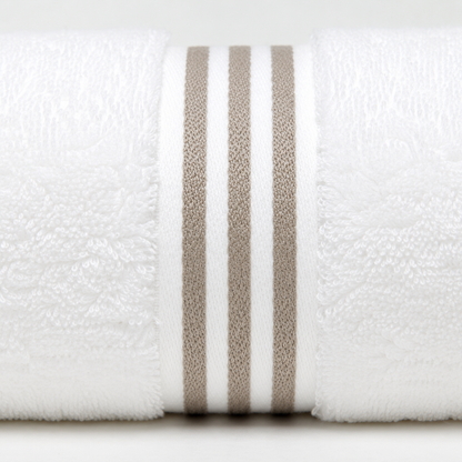 A close-up of a white textured towel roll with three vertical taupe-beige stripes on a light gray background.