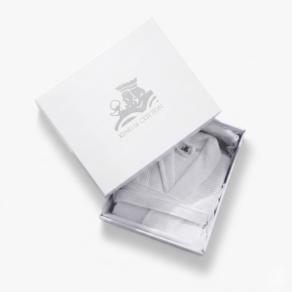 White bathrobe in a branded box with 'Silver Cotton' logo.