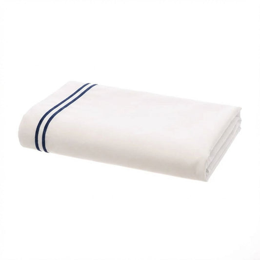 Folded white flat sheet with blue stripes on a white background